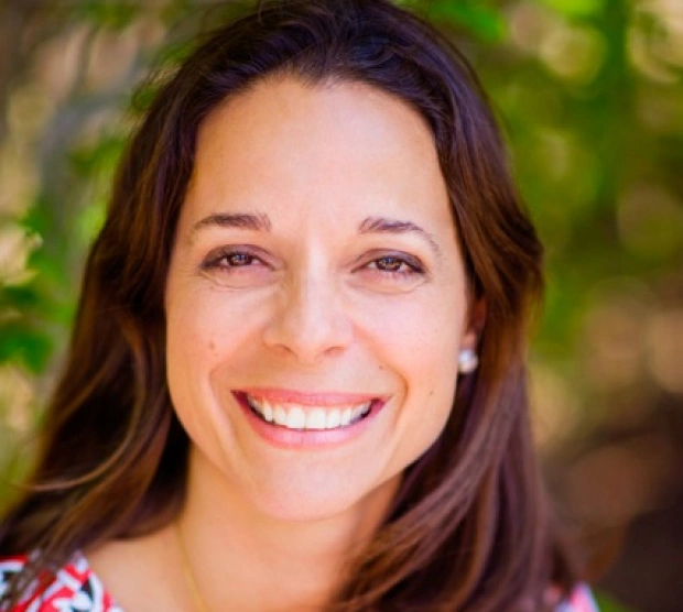 Dr. Mary Eve Maestre, orthodontist, smiling at her New York dental practice.